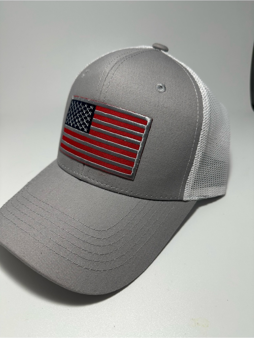 Gray and White Trucker Hat with American Flag Patch